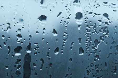 natural water drops on window glassの写真素材