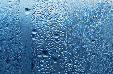 large and fine water drops on glassの写真素材