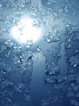 frosty natural pattern on winter windowの写真素材