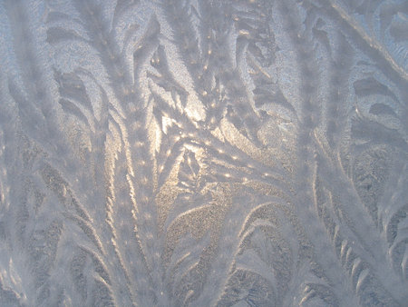 Frosty natural pattern on winter glassの写真素材