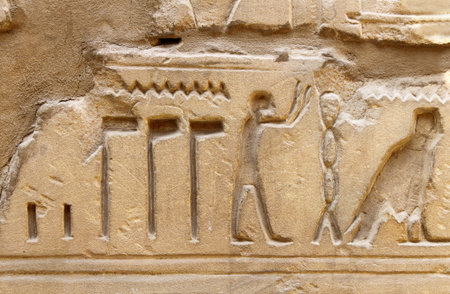 Ancient egypt images and hieroglyphics carved on the stone in the Karnak Temple, Luxor