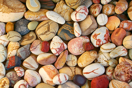 Set of beautiful colorful stones with different pattern polished by the sea, natural close-up...