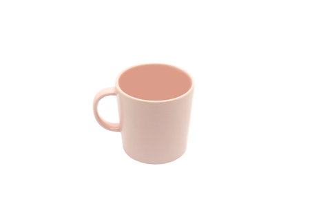 Pink ceramic cup with handle isolated on white backgroundの写真素材