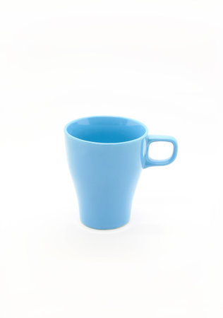 Bright blue ceramic cup with handle isolated on white backgroundの写真素材