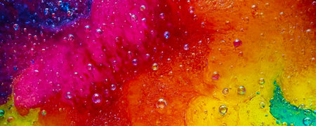 Multi-colored liquid with water drops, bright colorful background close-upの写真素材