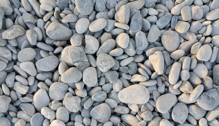 Nature background from gray sea pebbles
