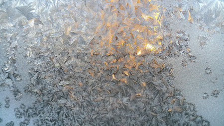 Texture of natural ice pattern on winter glass