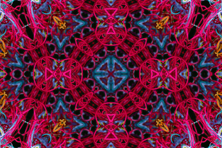 Abstract pattern of bright color threads on black background with 3D effect