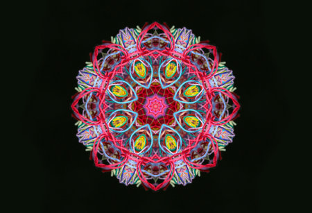 Abstract shape of bright multicolored threads isolated on a black background with 3D effectの写真素材