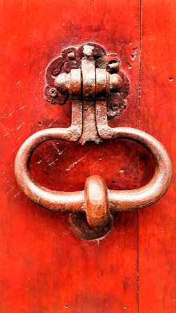 Vintage bright red wooden door with metallic doorhandle,Troyes, Franceの写真素材