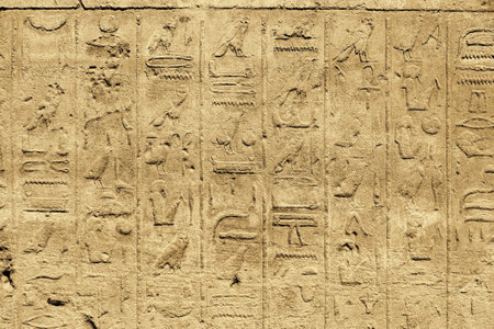 Ancient egyptian hieroglyphs carved on the wall in the Karnak Temple, Luxor, Egyptの写真素材