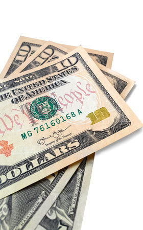 Banknotes of ten american dollars isolated on white background, close-up