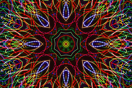 Abstract luminous pattern from colorful lines on black backgrond