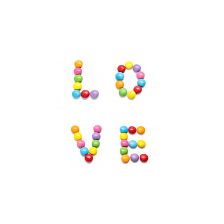 Word ''Love'' made from multicolored sweets candy on white backgroundの写真素材