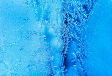 Beautiful ice pattern texture on winter glassの写真素材