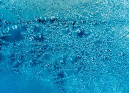 Natural texture of ice pattern on winter glassの写真素材