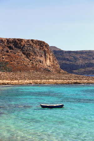 Beautiful sea view with clear turquoise water and empty boat, Gramvousa, Crete island, Greeceの写真素材