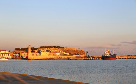 A beautiful view of harbour in Rethymno with lighthouse and fortress Fortezza at sunrise, Crete island, Greeceの写真素材