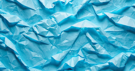 Background made of crumpled blue paper, texture for design, space for textの写真素材