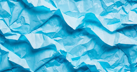 Blue background from crumpled and torn paper. Texture for design.の写真素材