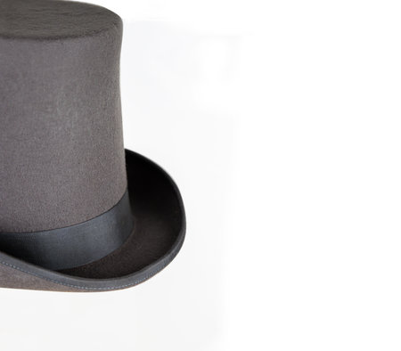 Elegant classic gray top hat with a flat crown and wide brim, representing elegance and timeless...