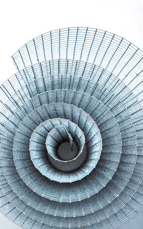 Abstract spiral metal coiled wire mesh with grid pattern, geometric symmetry, modern minimal design...