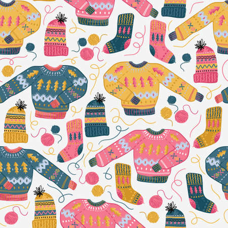 Needlework seamless pattern with sweater, knitting hat, sock and woolen tangles. Hand made clothes.の写真素材