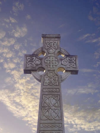 Carved Celtic cross under evening sky in Tullylish graveyard, Co. Down, Irelandの写真素材