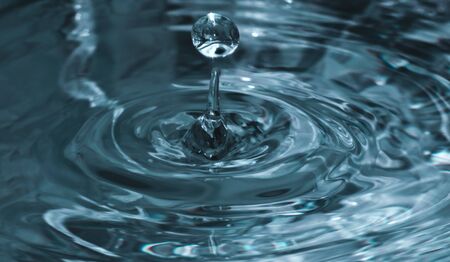 Water droplet Blue with rippleの写真素材