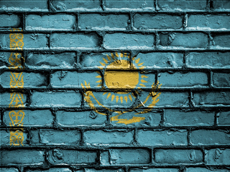 National Flag of Kazakhstan on a Brick Wallの写真素材