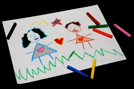 Children's drawing and pencils on the table の写真素材