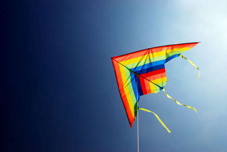 colours kite on the blue sky backgroundの写真素材