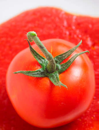 Juicy red tomato isolatedの写真素材