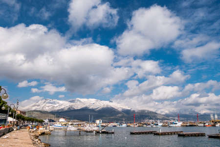 Sea landscape of Gaeta with cloudy sky and snowy mountains on background.の写真素材