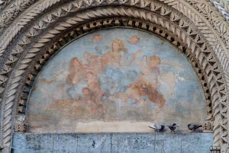 Atri, Teramo, Italy, August 2019: Fresco above the gate of the Cathedral of Atri, Basilica of Santa Maria Assunta, national monument since 1899, Gothic architectureのeditorial素材