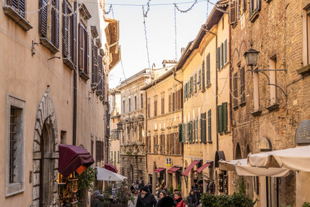 Montepulciano, Siena, Tuscany, Italy, December 2019: Main Street in Montepulciano during the Christmas time, tourists stroll to buy Christmas gifts.のeditorial素材