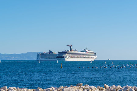 Cruise ships in the bay of Naples sailing towards the mediterranean sea, Capri Island on backgroundのeditorial素材