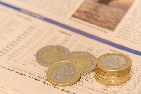 Euro coins of european currency on trading magazineのeditorial素材