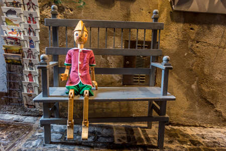 Wooden statue of Pinocchio with donkey ears and long nose. Pinocchio is the protagonist of a famous Italian fairy taleのeditorial素材
