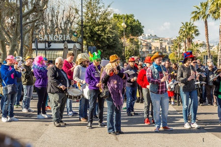 The cheerful and colorful band plays during during the Carnival Parade along the way of City of...