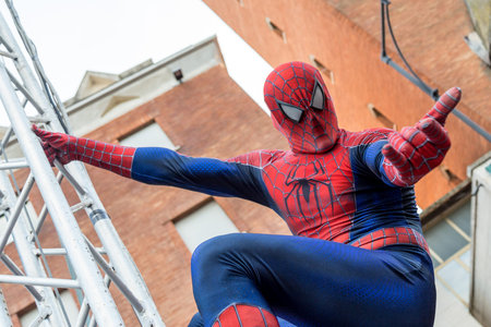 A man cosplaying the famous Marvel comic character, Spiderman during the Carnival Parade along the way of City of Gaetaのeditorial素材