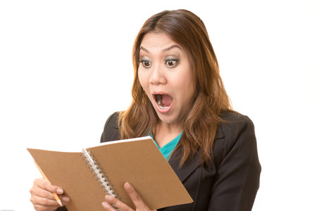 Woman shocked by noteの写真素材