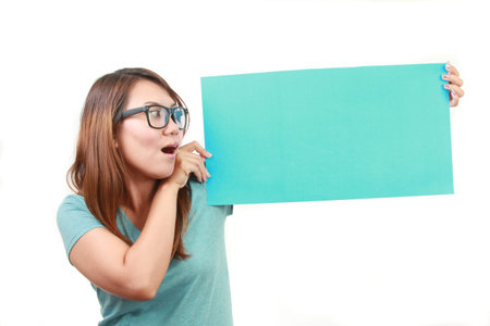 beautiful woman holding empty boardの写真素材