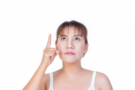 asian woman pointing finger up to somethingの写真素材