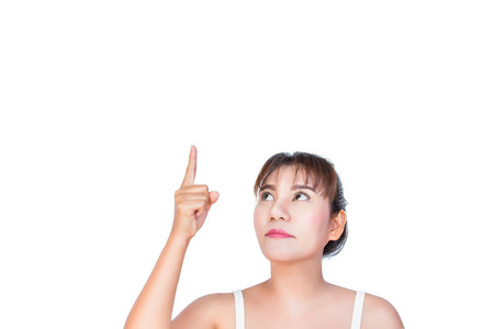 asian woman pointing finger up to somethingの写真素材