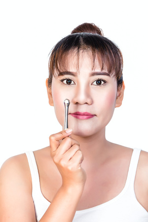 asian woman with Massage stick on white backgroundの写真素材
