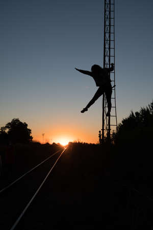 fun sunset, climb to the iron rust escalatorの写真素材