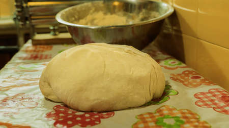 raw balls of bread in the kitchen tableの写真素材