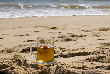Beer on sandy beachの写真素材