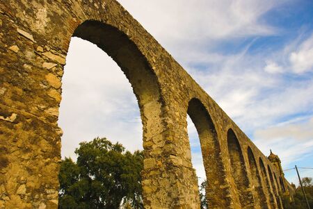 Arches of aqueduct in Evora, Portugalの写真素材